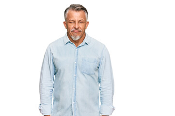 Sticker - Middle age grey-haired man wearing casual clothes relaxed with serious expression on face. simple and natural looking at the camera.