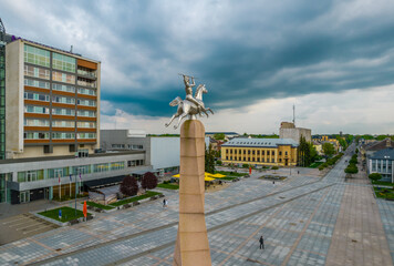 Poster - Aerial view of central square with monument in Marijampole city in Lithuania