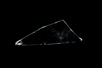 Wall Mural - glass fragments in isolation on a black background. damaged window. damaged object