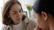 © ChayTee - unhappy young adult asia people female lady feel sorry cry upset pensive share moment negative issue with old mum help consult sit sofa couch at home hand stroking hug cuddle love protect compassion.