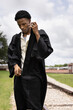Young African American Male High School Senior Graduation Cap and Gown Celebration 2021