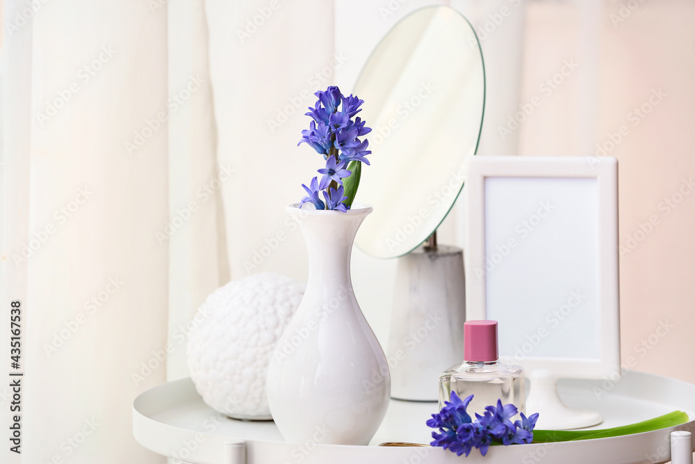 Beautiful composition with hyacinth flowers on table at home