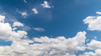 Wall Mural - 4k time lapse video scene of a group of fluffy white clouds movement whit blue sky on the day good w