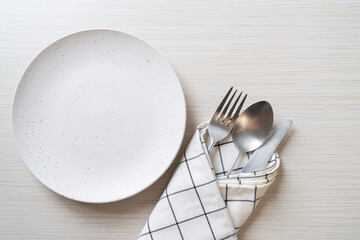 Wall Mural - empty plate or dish with knife, fork and spoon