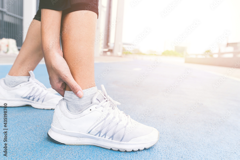 Close up Ankle Injury accident between exercise running and jogging on ...