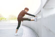 © setthawuth - Portrait of beautiful young woman exercising on  outdoor Running Track. female fitness model stretching exercise or warming up before work out. exercise, Fitness, workout, sport, lifestyle concept.