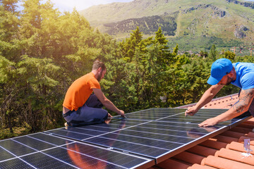 workers assemble energy system with solar panel for electricity and hot water