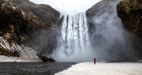 Wall Mural - skogafoss waterfall with solitary person