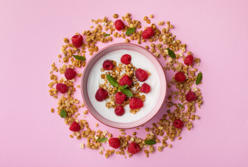 Wall Mural - Bowl with greek yogurt, raspberries and granola. Top view flat lay. Healthy snack and nutrition breakfast.