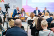 © Anton Gvozdikov - Speakers discussing business problems in auditorium