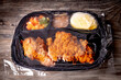 Fried Chicken TV dinner frozen and covered in cellophane