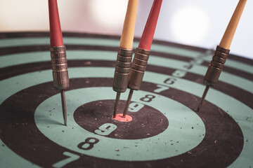 Bullseye is a target of business. Dart is an opportunity and Dartboard is the target and goal. So both of that represent a challenge in business marketing as concept.