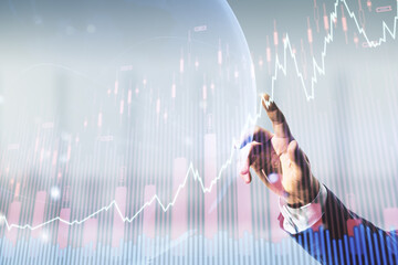 Poster - Multi exposure of analyst hand clicks on virtual abstract financial graph and world map on blurred office background, financial and trading concept