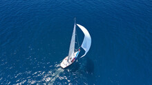 Aerial Drone Top Down Photo Of Beautiful Sailing Boat Cruising In Deep Blue Atlantic Open Ocean Sea