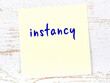 © iushakovsky - Yellow sheet of paper with word instancy. Reminder concept