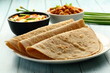 Homemade delicious whole wheat chapati served with chickpeas ,masala curry, Indian  traditional foods background,