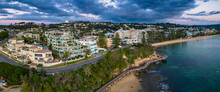Aerial Sunrise Shorescape Panorama With Rain Clouds Rolling In