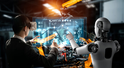 Mechanized industry robot and human worker working together in future factory . Concept of artificial intelligence for industrial revolution and automation manufacturing process .