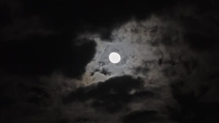 Wall Mural - full moon moving between clouds, timelapse, 4k