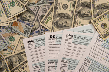 dollar bills on US individual 1040 tax form