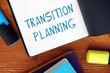 Business concept about TRANSITION PLANNING exclamation marks with phrase on the page.