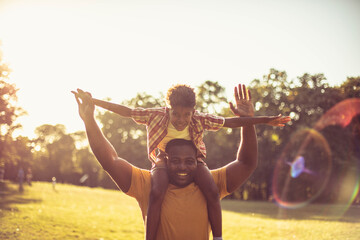 Wall Mural -  African American father and son in nature.