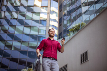 Wall Mural - Business man walking and using mobile.