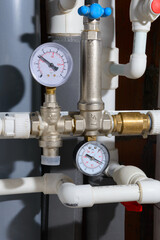 Water supply pipes with pressure gauges, valves and check valve