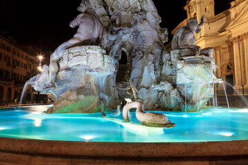 Wall Mural - Fountain of Four Rivers of Piazza Navona illuminated in the night . Italian Baroque architecture in Rome