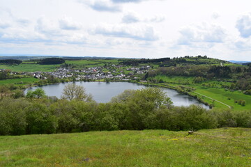 Wall Mural - Schalkenmehrener Maar und Dorf Schalkenmehren im Frühling