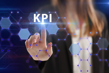 Business, Technology, Internet and network concept. Young businessman working on a virtual screen of the future and sees the inscription: KPI