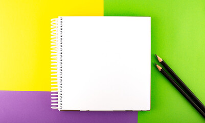 Poster - Minimal work space : sketchbook on the colorful background. Top view , flat lay