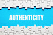 The word authenticity framed by jigsaw puzzle pieces. To discover or reveal the truth, reality or reliability