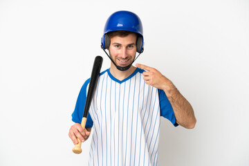 Wall Mural - Young caucasian man playing baseball isolated on white background giving a thumbs up gesture