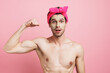 © Drobot Dean - Young shirtless man wearing headband showing her biceps at camera