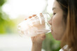 © waranyu - woman drinking fresh water, healthcare concept