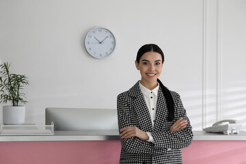 Poster - Portrait of receptionist near countertop in office, space for text