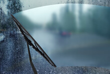 Car Windshield Wiper Cleaning Water Drops From Glass While Driving