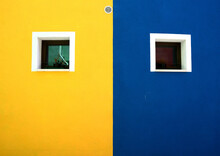 Yellow Wall With Blue Windows