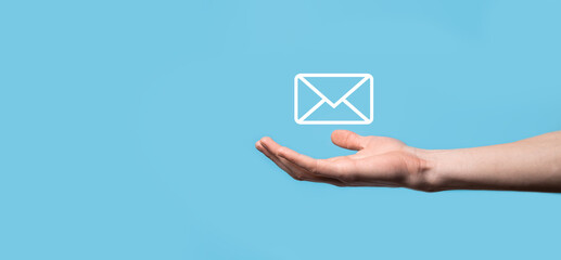 Male hand holding letter icon,email icons .Contact us by newsletter email and protect your personal information from spam mail. Customer service call center contact us.Email marketing and newsletter