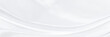 White gray satin texture that is white silver fabric silk panorama background with beautiful soft blur pattern natural.