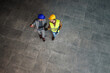 © Dusan Petkovic - Aerial view of construction worker and architect walking on construction site and discussing about project.