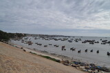 Fototapeta Morze - Fishing boats at the coast of Mui Ne, Vietnam