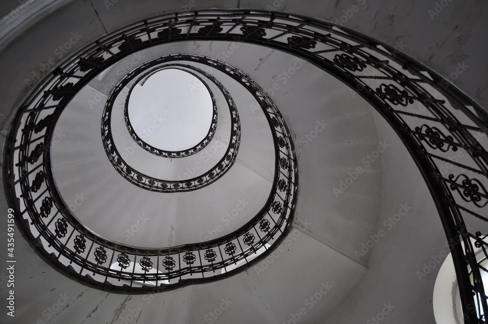 Design spiral staircase inside an old building, circular architectural ...