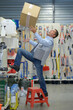 © auremar - worker falling off ladder in the warehouse