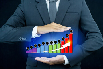 Businessman and business performance chart growing ,business growth concept