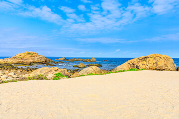 Landscape with beach,the sea and the beautiful clouds in the blue sky.rocks on the beach.