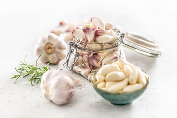 Wall Mural - Garlic concept consisting of a jar full of lovely aromatic garlic cloves