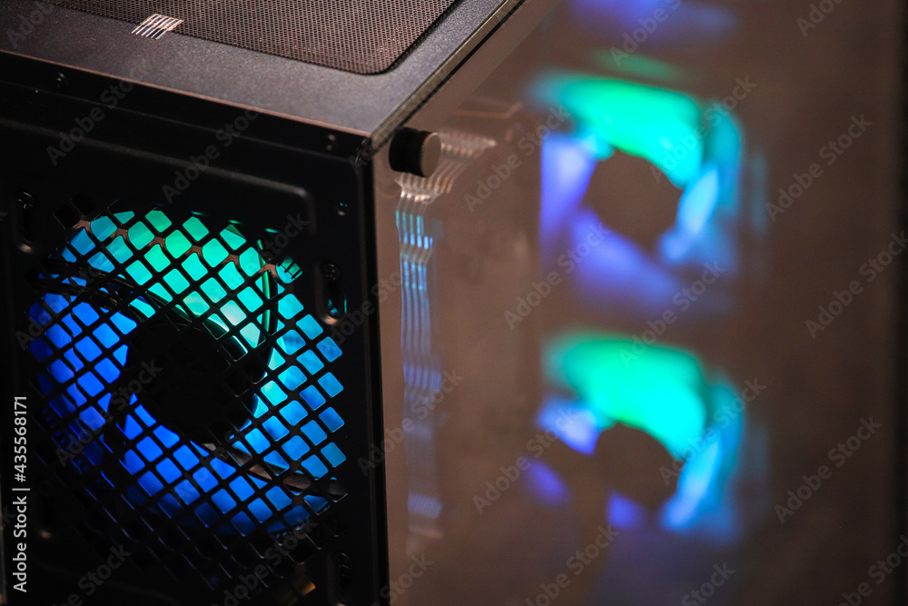 Blue illumination of a cooler PC system unit. Computer fan with LED illumination. Backlight. Cooler. 