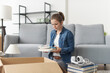 © StockPhotoPro - Young woman moving in her new apartment